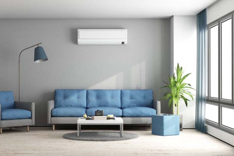 Ductless mini split mounted to wall above couch in Modesto, CA, home.