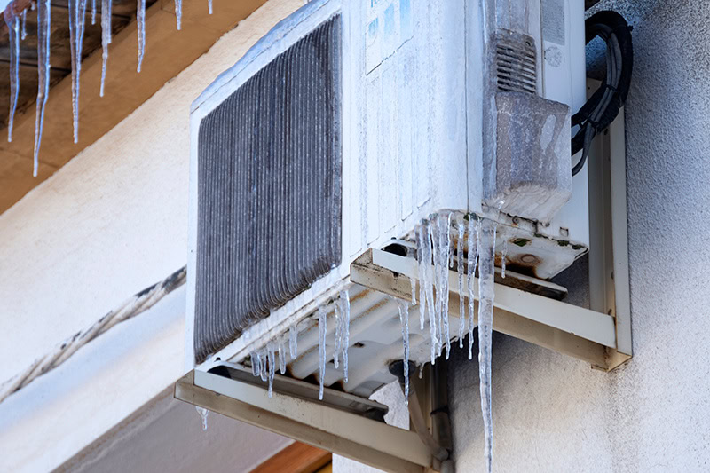 Why Is My Heat Pump Freezing Up? Ice on the outside of a heat pump.